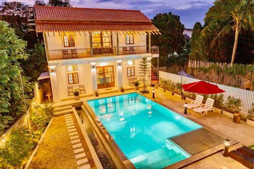 an aerial view of a house with a swimming pool at Villa Mandiri at ThaPae Gate - Top Location in Chiang Mai
