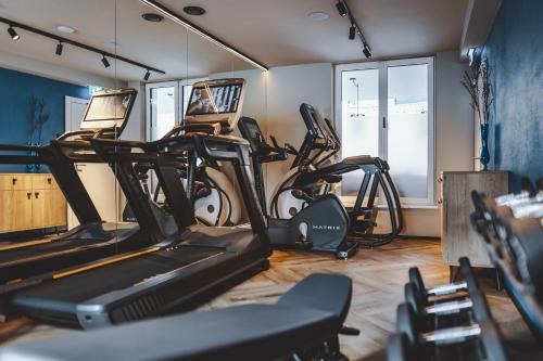a gym with several exercise bikes in a room at The Gast House Zell am See in Zell am See