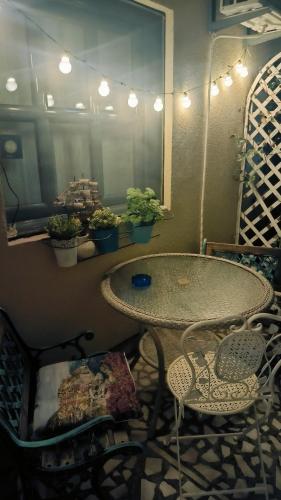 a table and chairs in a room with a mirror at Apartament - Lisa in Budva