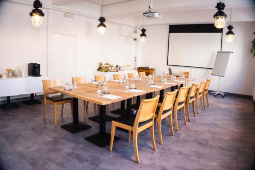 a large conference room with a long table and chairs at Hotel Mokotów in Warsaw