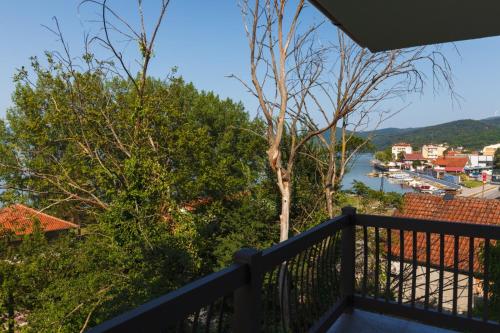 a balcony with a view of a river at Apartmani PORTO in Golubac