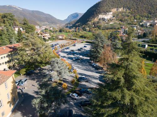 an aerial view of a river in a town with trees at Hotel San Pancrazio in Trescore Balneario