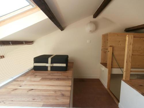 a attic room with a bench and a bed at Cabanon Calanque Marseille in Le Rove