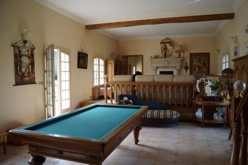 a living room with a pool table in it at Le Relais De Dalibray in Seraincourt