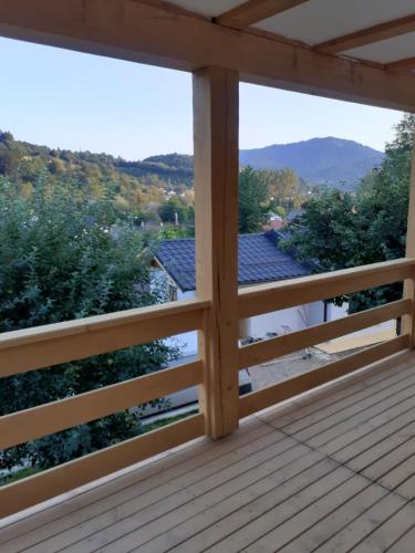 a view from the deck of a house with a view of the mountains at Casa Mara Viseu de Sus in Vişeu de Sus