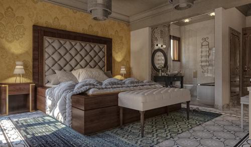 een slaapkamer met een groot bed en een badkamer bij Eileen Hotel Cairo in Caïro