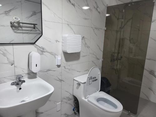 a bathroom with a toilet and a sink and a shower at Philstay Ehwa Boutique - Female Only in Seoul