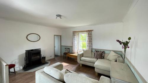 a living room with a couch and a tv at North Middleton Apartment in North Middleton