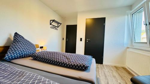 Ένα ή περισσότερα κρεβάτια σε δωμάτιο στο B&W Apartments