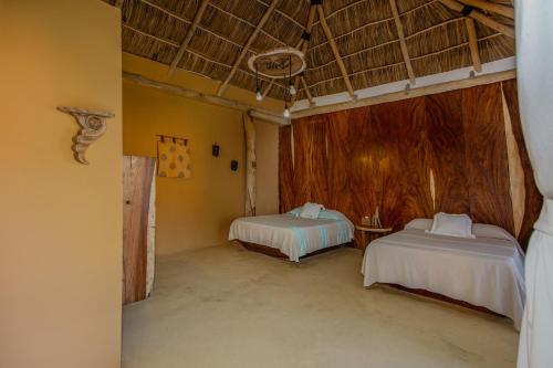Postel nebo postele na pokoji v ubytování Amaca Beach Retreat - Puerto Vallarta South Shore