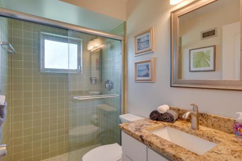 a bathroom with a sink and a shower at Waterfront Cape Coral Home Dock and Screened Porch in Cape Coral