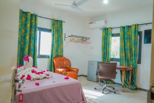 Ένα ή περισσότερα κρεβάτια σε δωμάτιο στο MGM Apartments Gambia