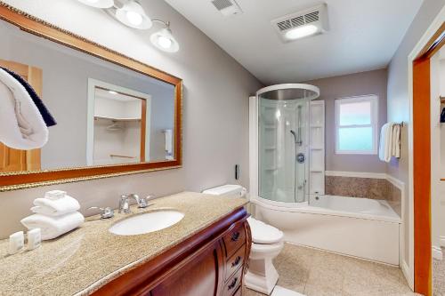 a bathroom with a sink and a toilet and a shower at Emerald Acres in McKinleyville