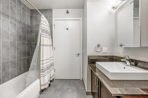 a bathroom with a sink and a shower at Amazing Loop Studio w Pool Gym nr L CHI-721 in Chicago