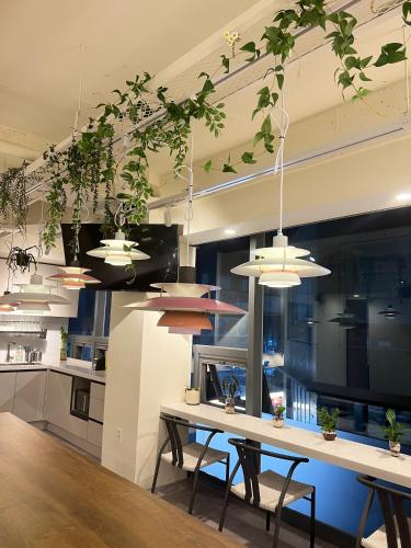 a kitchen with a table and some potted plants at Seoul Cube Jongro in Seoul