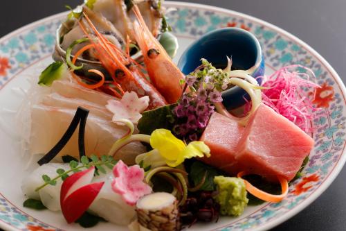 a plate full of food on a table at Kaikatei Hanagozen in Kyotango