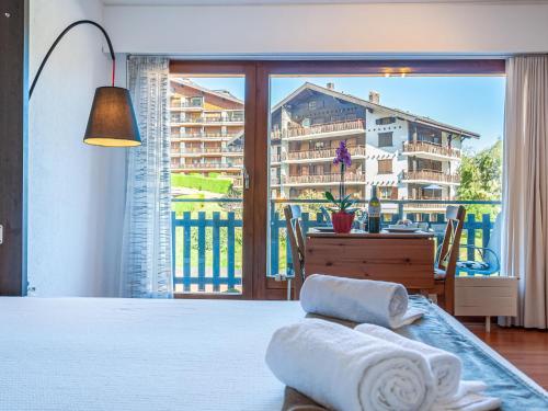 a bedroom with a view of a apartment at Studio Bouleaux K4 by Interhome in Nendaz