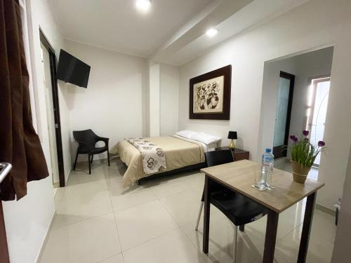 Postel nebo postele na pokoji v ubytování Gran Caral Hotel