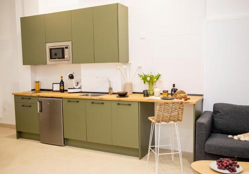 Η κουζίνα ή μικρή κουζίνα στο Apartamentos La Tahona Cádiz Centro