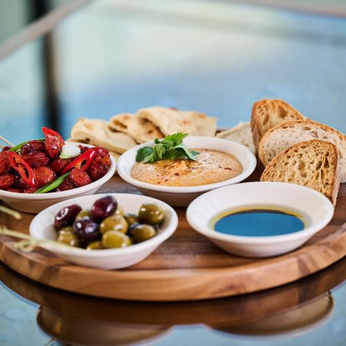 a tray with different types of food on a table at Genting Hotel & Spa at Resorts World Birmingham in Bickenhill