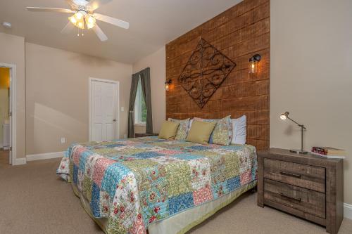 a bedroom with a large bed and a wooden headboard at Carmel Sunday in Swanton