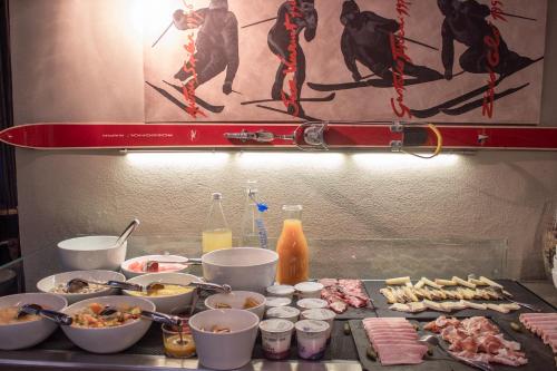 a bunch of food on a counter in a kitchen at Hotel 3 Vallées Val Thorens in Val Thorens