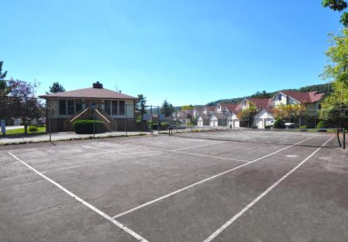 a parking lot with a tennis court at Ski Harbor 14 in McHenry