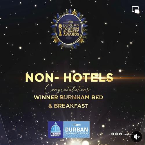 a sign for the normanhotels winter burnham bed and breakfast at Burnham House B&B in Durban