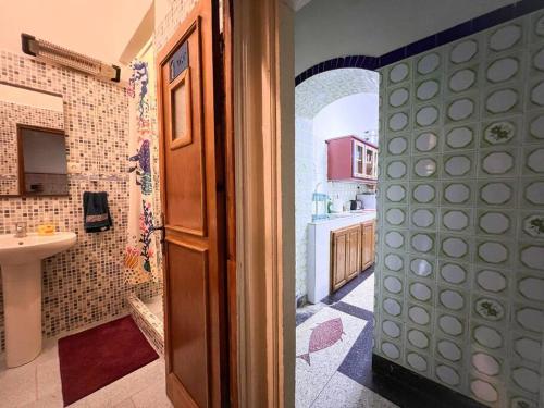 a bathroom with a sink and a sink at Historic Rue de la Kasbah Villa in Tangier