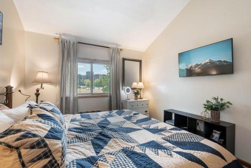 a bedroom with a bed and a window at Slope Side in McHenry