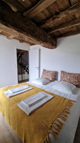 Postel nebo postele na pokoji v ubytování Les gîtes du Haut Pin