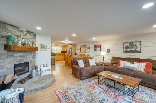 a living room with a couch and a fireplace at Walk to Sugar Mountain Resort Ski, Golf and Hike! in Sugar Mountain