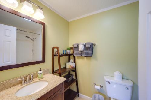 a bathroom with a sink and a toilet and a mirror at Walk to Sugar Mountain Resort Ski, Golf and Hike! in Sugar Mountain