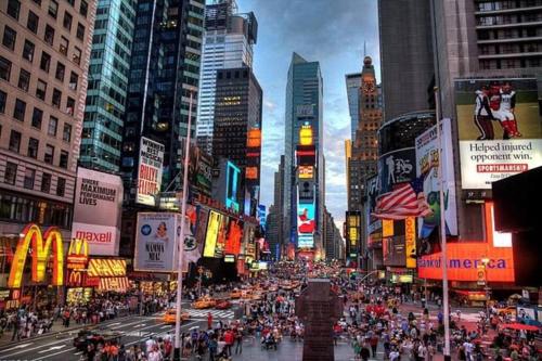 a crowd of people crossing a busy city street at SWJ 3rd - Sleeps 7,Close to LGA,Times Sq in 25 min in New York