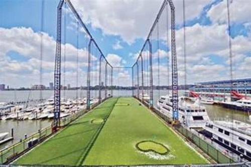 a bridge over the water with a golf course on it at SWJ 3rd - Sleeps 7,Close to LGA,Times Sq in 25 min in New York