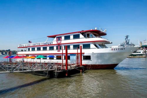 a large cruise ship docked at a dock at SWJ 3rd - Sleeps 7,Close to LGA,Times Sq in 25 min in New York