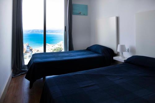 Postel nebo postele na pokoji v ubytování Apartamentos turísticos Cullera