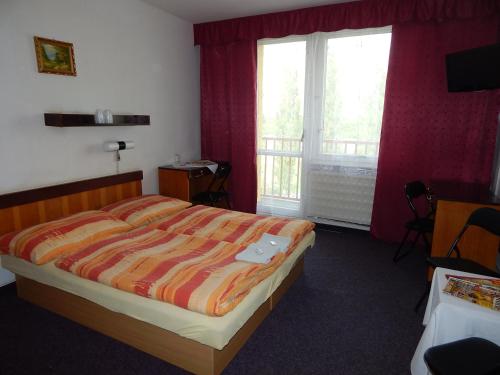 Posteľ alebo postele v izbe v ubytovaní ABC Hotel Nitra