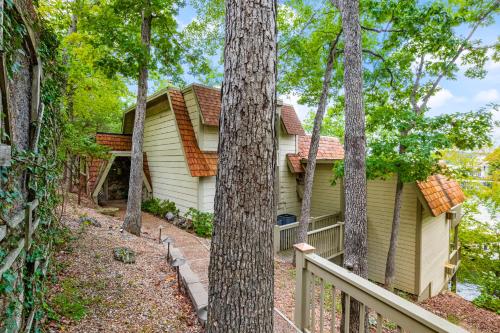 a house in the woods with trees at Grammy and Papas Lakeside Dugout in Osage Beach