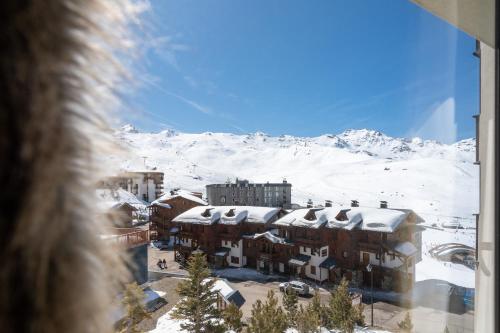 a view of a building with snow covered roofs at Hotel 3 Vallées Val Thorens in Val Thorens