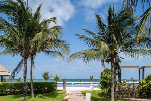 a view of the beach from the resort at Seacost Beachfront 2BDR with pool by Casa Paraiso in Cancún