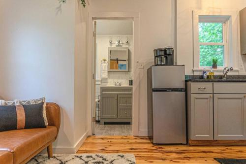 a kitchen with a stainless steel refrigerator in a room at Double The Fun II Two Houses and fire pit in shared yard in Kingston
