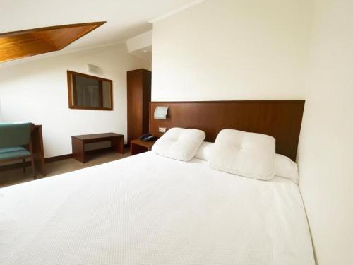 Postel nebo postele na pokoji v ubytování Hotel EntreRobles