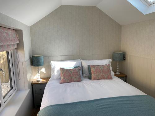 Ένα ή περισσότερα κρεβάτια σε δωμάτιο στο Hillview Cottage