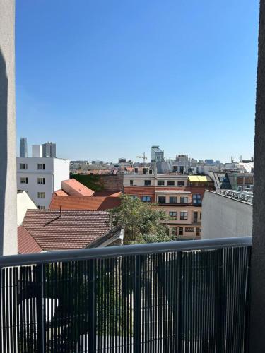 a view of a city from a balcony at LEO Apartment FREE PARKING - President Palace in Bratislava