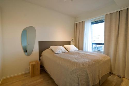 Postel nebo postele na pokoji v ubytování Enchanting One Bedroom Apartment