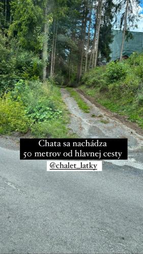 a sign on the side of a road at Chalet Látky in Látky