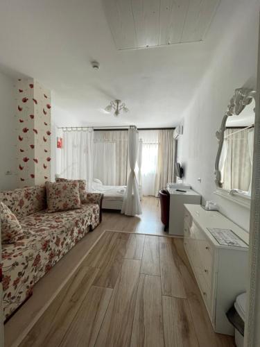 a living room with a couch and a table at Hotel Prestige in Alba Iulia