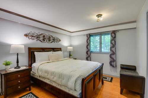 a bedroom with a large bed and a window at Winhall Home with Sauna Less Than 1 Mi to Stratton Mountain! in Stratton Mountain