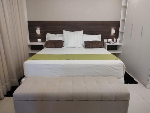 Ένα ή περισσότερα κρεβάτια σε δωμάτιο στο Hotel Jucazinho